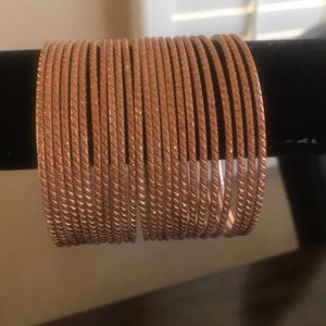 Rose gold bangles.